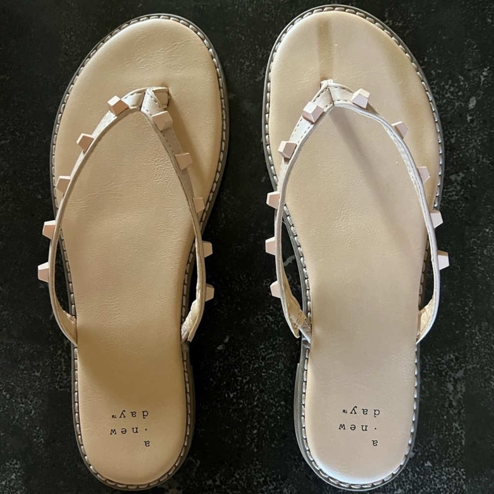 Tan flip flops